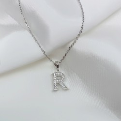 delicate and glowing letter pendant in sterling silver  delicate and glowing letter pendant in sterling silver