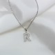 delicate and glowing letter pendant in sterling silver 