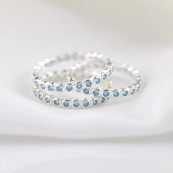 Blue sapphire bezel eternity ring Blue sapphire bezel eternity ring