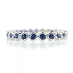 Blue sapphire bezel eternity ring Blue sapphire bezel eternity ring