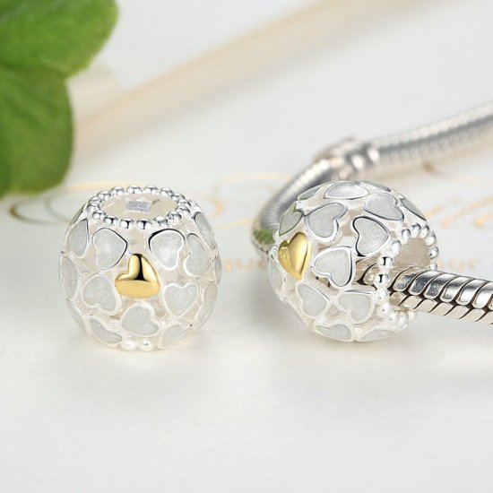 silver bead with white and gold hearts 