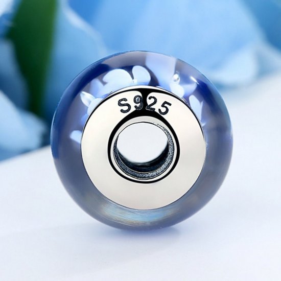 blue glass bead with white flowers