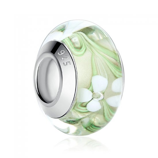 clear-green glass bead with flowers