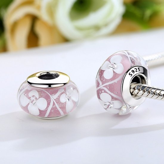 pink glass bead with white flowers