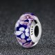 purple glass bead with pink and white flowers